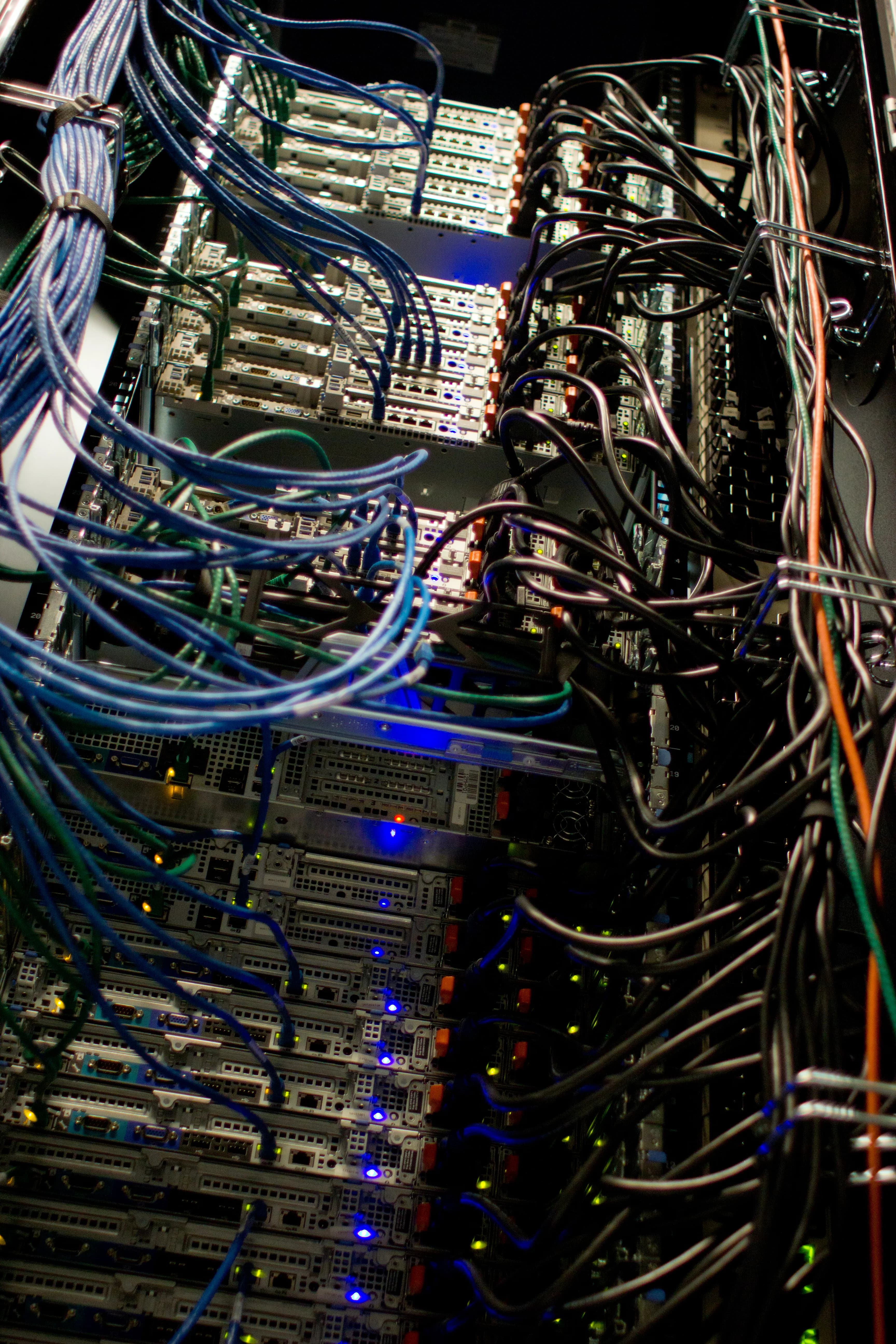Server racks in a data centre where the infrastructure behind AI workloads is operated.