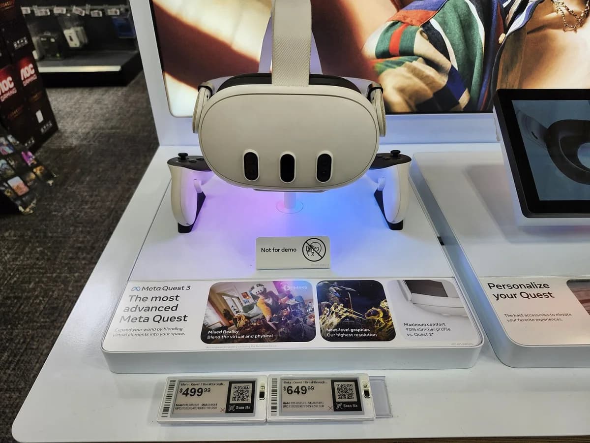 A Meta Quest 3 on a retail display with two controllers.