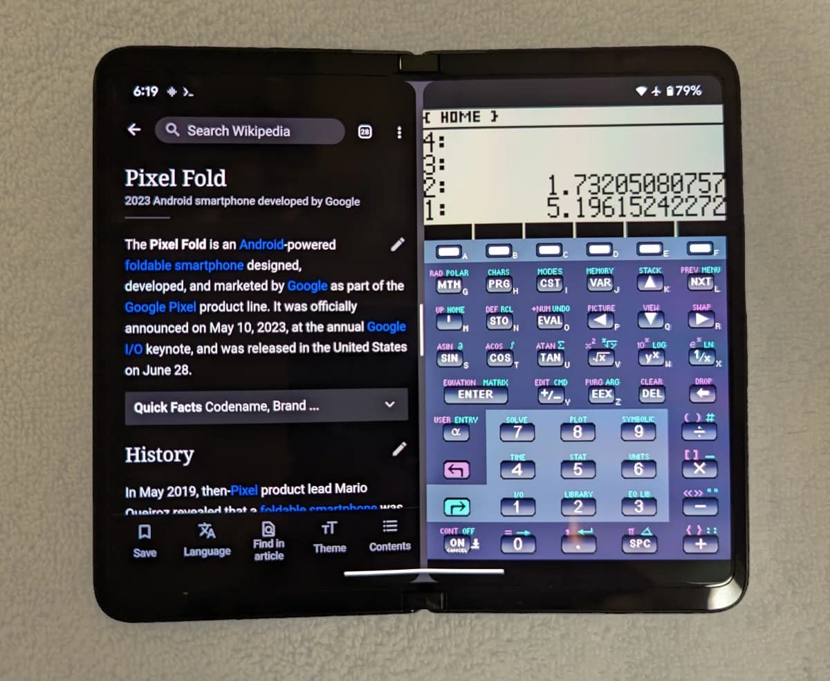 A Google Pixel Fold opened wide, showing web content and apps.